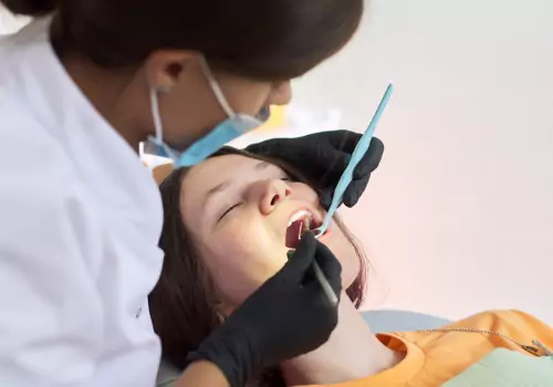 A woman relaxing while having her teeth cleaned, thanks to Sedation Dentistry in Clinton IL