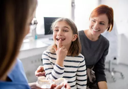 A mother and her child speaking with a Family Dentist in Pekin IL