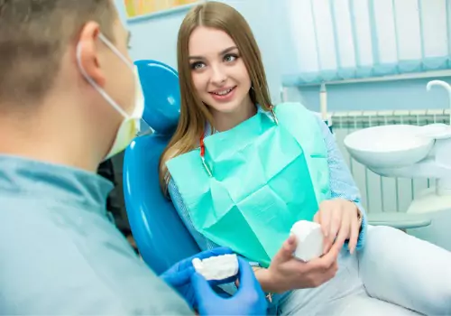 A woman discussing her dental treatment procedure before implementing Sedation Dentistry in Pekin IL