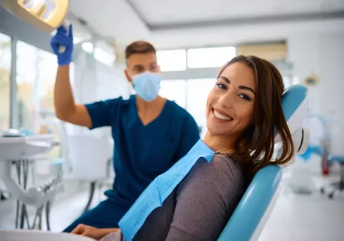 A happy woman after receiving teeth cleaning at a Dental Office in Pekin IL