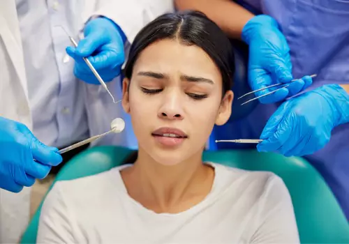 A worried woman needing Sedation Dentistry in McLean County IL