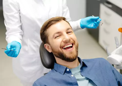 A smiling man in the dentist's chair of a Cosmetic Dentist near East Peoria IL