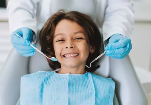A child smiles after receiving Dental Services in Pekin IL from Total Dental Care