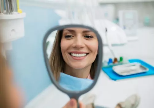 A woman is seen at a dental appointment. Total Dental Care offers Teeth Cleaning in Peoria IL