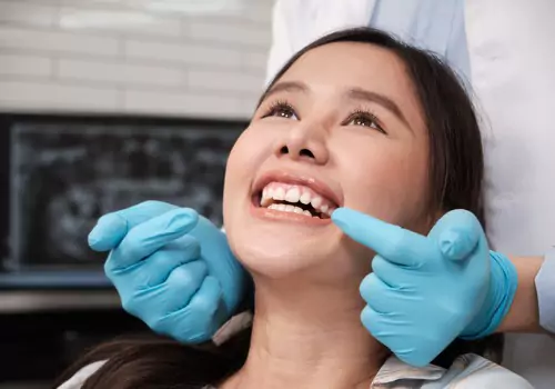 Safest Dental Sedation 1 A woman smiles after getting a procedure done using oral sedation and nitrous oxide, which is one of the Safest Dental Sedation options available